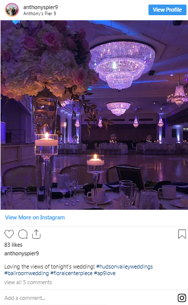 A screenshot of a social media post of a room with a lit candle.